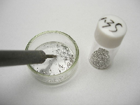Applying minimal tin to solder tip with solder balls